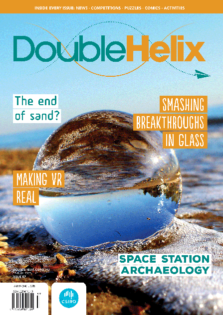Double Helix issue 57 cover image featuring a glass sphere on the beach.